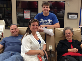 On July 8, Bernice Hennig (right), from Stony Plain, made her 828th blood donation with Canadian Blood Services in Edmonton. But since her son (Jody Hennig), his wife (Brenda), and their son (Ryan) came along to make their own donations, the day was extra special. For Ryan, this was his first time giving blood and as a third generation donator, he feels it’s pretty much hereditary at this point. - Photo Supplied