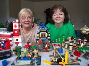 Valerie Kekanovich and Karen Fraser among some of the extension Lego collection which once belonged to Mark Valcour -- an Ottawa man who died suddenly in January and wanted his Lego collection donated to CHEO. 
DANI-ELLE DUBE/OTTAWA SUN