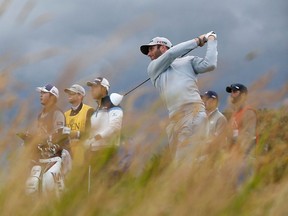 Dustin Johnson watches his tee shot on the ninth hole during the second round of the British Open Friday at the Old Course in St. Andrews, Scotland. (REUTERS/Paul Childs)