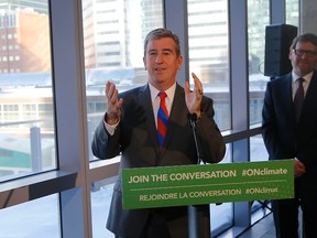 Ontario Climate Change Minister Glen Murray makes remarks on a start tocarbon reduction for Ontario at Telus House on Feb. 12, 2015. (Michael Peake/Toronto Sun)