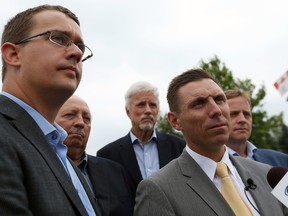 MPP's Monte McNaughton, Bob Bailey, Rick Nicholls and Jeff Yurek (back left to right) join Ontario PC leader Patrick Brown (second from right) as he comments to the media during a manufacturing tour in Windsor on   July 17, 2015. (Tyler Brownbridge/The Windsor Star)