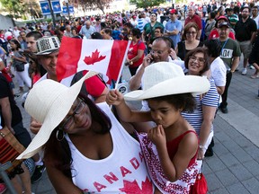 Fans wait for the gates for the opening ceremonies to open at the Rogers Centre ahead of the 2015 Pan Am Games on July 10, 2015. (Dave Abel/Toronto Sun)