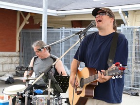 Eric Gervais, left, and Tim Hietanen, of DT Collective, perform at the Blueberry Blast at Market Square off of Elgin Street in Sudbury, Ont. on Saturday July 18, 2015. The festivities, which included the Sudbury Credit Union pancake breakfast, live bands, children’s entertainment and vendors, was part of the Sudbury Blueberry Festival. John Lappa/Sudbury Star/Postmedia Network
