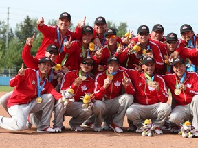 Canada shows off its softball gold medal after beating Venezuela in Ajax yesterday. Veronica Henri/Toronto Sun photos
