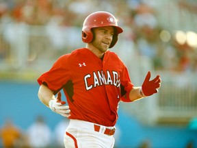 Skyler Stromsmoe of Team Canada takes first base after being hit by a pitch in last night’s semifinal. (VERONICA HENRI/Toronto Sun)
