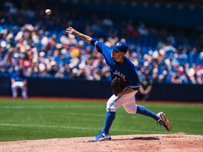Blue Jays pitcher Marco Estrada works against the Rays during second inning MLB action in Toronto on Sunday, July 19, 2015. (Aaron Vincent Elkaim/THE CANADIAN PRESS)