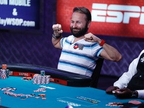 Daniel Negreanu stretches while playing at the World Series of Poker main event Tuesday, July 14, 2015, in Las Vegas. (AP PHOTO)