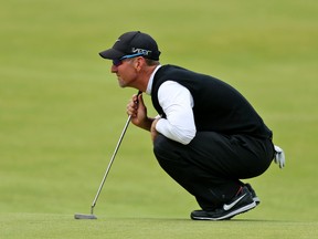 David Duval lines up a putt on the 18th green during the third round at the British Open at the Old Course, St. Andrews, Scotland, on Sunday, July 19, 2015. (Peter Morrison/AP Photo)