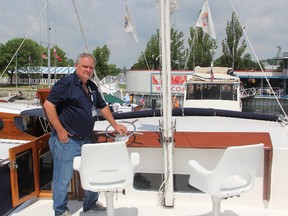 Scott Young poses on the main of Escapade, a 1977 boat he's been restoring over the last four years at the fifth Antique and Classic Boat Show at Sarnia Bay Marina. The 54-foot vessel was originally used to ferry personnel and supplies to U.S. warships, but was decommissioned in the 1990s.
PHOTO TAKEN at Sarnia, Ontario on Saturday, July 18, 2015
(CHRIS O’GORMAN/ SARNIA OBSERVER/ POSTMEDIA NETWORK)