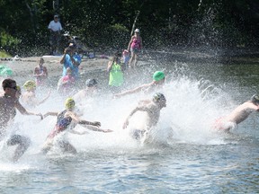 Swimmers hit the water for the Ian McCloy Island Swim at the university beach on Lake Nepahwin on Sunday. Ben Leeson/The Sudbury Star/Postmedia Network