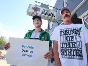 Glenn Price (right), owner of Winnipeg's first medical marijuana dispensary and Steven Stairs, medical marijuana advocate, stand outside Price's Main Street  business on Sunday. Stairs is organizing a protest in support of the business at the Public Safety Building on Monday. (Kevin King/Winnipeg Sun)