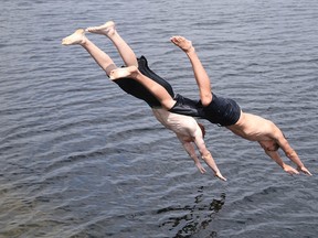 Gino Donato/The Sudbury Star
Michael Andlar and Dakota Coggins cool off in Ramsey Lake on June 15.