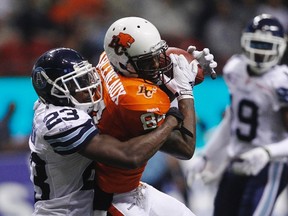 Argonauts defensive back Vincent Agnew makes a tackle on a Lions receiver last season. (REUTERS)