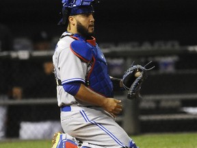 Blue Jays catcher Dioner Navarro was part of a strike-em-out, throw-em-out that ended the second inning against Tampa Bay on Sunday. (The Associated Press)