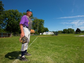 78-year-old Bob Pearson of Strathroy west of London, Ont. continues to catch in the over-30 baseball league. (MIKE HENSEN, The London Free Press)