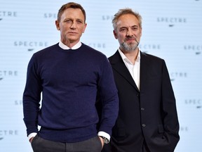 British director Sam Mendes (R) and actor Daniel Craig (L) pose during an event to launch the 24th James Bond film 'Spectre' at Pinewood Studios at Iver Heath in Buckinghamshire, west of London, on December 4, 2014. (AFP PHOTO / BEN STANSALL)