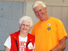 Canadian Blood Services volunteer Evelyn Babbitt presents Wallaceburg's Jerry Peats with a pin in honour of him giving blood for the 100th time, at a blood donation clinic held at the UAW Hall on July 16.