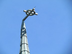 Environment Canada said damage in Sarnia, Ont., including a bent cross at the top of St. Andrew's Presbyterian Church on Christina Street, shown here on Monday July 20, 2015, indicates winds may  have reached 90 to 100 km/h in parts of Sarnia during Saturday's storm.  (Paul Morden, The Observer)