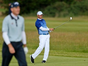 Canada’s Graham DeLaet plays a shot from the 17th fairway during the third round at the British Open at the Old Course in St. Andrews, Scotland on July 19, 2015. (AP Photo/Peter Morrison)