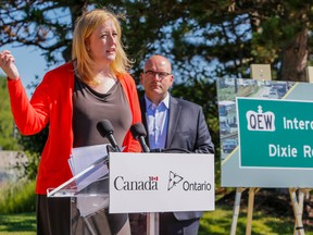 Federal Transport Minister Lisa Raitt and Ontario Transportation Minister Steven Del Duca are pictured during an announcement at the Dixie Outlet Mall in Mississauga. (DAVE THOMAS, Toronto Sun)