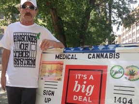 Glenn Price held a marijuana smoke-in on Monday in front of the police Public Safety Building. (DAVID LARKINS/WINNIPEG SUN)