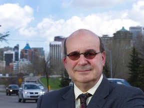 Jack Mintz poses with part of downtown Calgary, Alta. in the background on Tuesday May 20, 2014 in Calgary. Mintz will release a report on the municipal infrastructure plans to come in Calgary. Holly Mandarich / Special to The Sun / QMI Agency