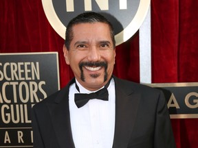 In this Jan. 18, 2014 file photo, Steven Michael Quezada an actor on the series "Breaking Bad," arrives at the 20th annual Screen Actors Guild Awards in Los Angeles. Quezada is jumping in a race for a heated county commissioner seat in Albuquerque. ( Matt Sayles/Invision/AP, File)