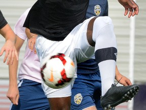 Defender Ade Adeniyi works out with FC London at TD Stadium on Monday. Adeniyi has been in the team?s plans for a while but has only recently been able to join the PDL club. (MORRIS LAMONT, The London Free Press)