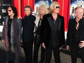 In this June 8, 2012 file photo, L-R: Musicians Vivian Campbell, Rick Allen, Rick Savage, Joe Elliott and Phil Collen of Def Leppard arrive for the world premiere of the film "Rock of Ages" in Hollywood, California. AFP PHOTO/Frederic J. BROWN