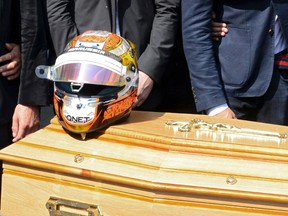 The helmet of late Marussia Formula One driver Jules Bianchi is placed on his coffin at the end of the funeral ceremony at the Sainte Reparate Cathedral in Nice, July 21, 2015. (REUTERS/Jean-Pierre Amet)
