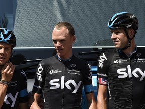 Cyclists of the Great Britain's Sky cycling team : Ireland's Nicolas Roche, Great Britain's Christopher Froome, the overall leader's yellow jersey, and Great Britain's Ian Stannard. (AFP/ERIC FEFERBERG)