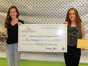 Twelve year-olds Lauryn Foss and Charlotte Jewell drop off a $500 oversized cheque at the Sarnia & District Humane Society on July 13. The two friends decided to forego birthday gifts this year in exchange for donations to the Humane Society.
CARL HNATYSHYN/SARNIA THIS WEEK