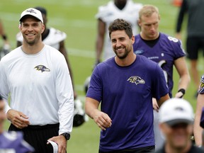 Baltimore Ravens tight end Dennis Pitta, right, walks off the field with tight ends coach Richard Angulo after  NFL football minicamp, Wednesday, June 17, 2015, in Owings Mills, Md. (AP/Patrick Semansky)