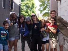 SUBMITTED PHOTO
Filmmakers (left to right) David Beylerian, Mercedes Thorne, Jessica Alexander, Victoria Sukha, Kassie Austin, Hudson MacDonald and Thomas Lewis take a break for a group picture while filming their short films in downtown Trenton. The young film makers are part of the Get Reel Film Camp.