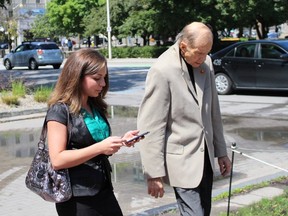 Maygan Sensenberger, 26, leaves the Ottawa courthouse on Tuesday, July 21, 2015 with her husband, retired Liberal Senator Rod Zimmer. Sensenberger got probation after pleading guilty to mischief, a weapons charge and a breach relating to two incidents in 2014 and 2015, one of which saw her arrested at gunpoint. (TONY SPEARS/Ottawa Sun/Postmedia Network)