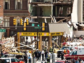 Rescue workers search through rubble following a building collapse in Philadelphia June 5, 2013. REUTERS/Eduardo Munoz