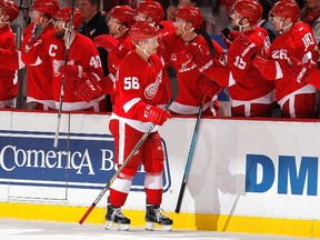 Teemu Pulkkinen of the Detroit Red Wings celebrates his third-period goal with teammates while playing the Edmonton Oilers at Joe Louis Arena on March 9, 2015 in Detroit, Michigan.  (Gregory Shamus/AFP)