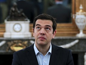 Greek Prime Minister Alexis Tsipras looks on during a swearing in ceremony of members of his government at the Presidential Palace in Athens, Greece July 18, 2015. (REUTERS/Alkis Konstantinidis)