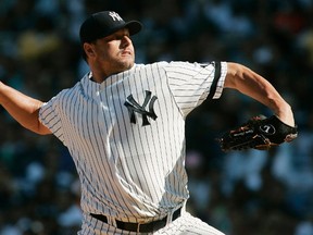 New York Yankees starting pitcher Roger Clemens throws during an American League game at Yankee Stadium in New York in this  August 18, 2007 file photo. (REUTERS/Ed Betz/Files)