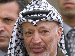 A file picture taken on July 29, 2000 shows Palestinian leader Yasser Arafat talking to the press at the Elysee presidential palace in Paris. French experts ruled out that the 2004 death of Arafat was the result of poisoning back in March and prosecutors are now recommending the case be dismissed. AFP Photo/Georges Gobet