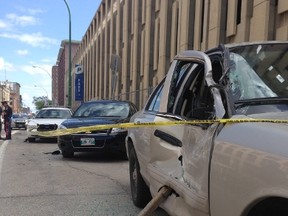 Several Winnipeg police vehicles were rammed in front of the Public Safety Building by a male suspect driving a truck on Monday. (DAVID LARKINS/WINNIPEG SUN)