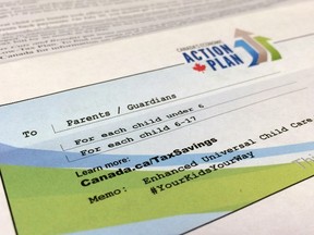 A photo of information distributed with Universal Child Care Benefit cheque's distributed this week is seen Tuesday July 21, 2015. THE CANADIAN PRESS/Adrian Wyld