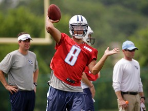 In this June 18, 2015, file photo, Tennessee Titans quarterback Marcus Mariota passes during the NFL football team's minicamp in Nashville, Tenn. Mariota signed with the Titans on Tuesday, July 21, becoming the last of the NFL's first-round draft picks to finalize his deal. (AP Photo/Mark Humphrey, File)