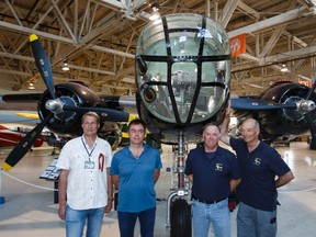 Flight team members (left to right), Valentin Lavrentyev and Sergey Barmov of Russia, Jeff Geer and Allan Snowie of the U.S. pose in front of a North American B-25 Mitchell bomber at the Alberta Aviation Museum Tuesday. The four are recreating secret flights that occurred during the Second World War between the U.S. and Russia. (IAN KUCERAK/Edmonton Sun)