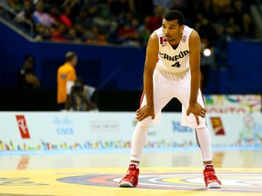 Jamal Murray of Team Canada takes a breather against the Dominican Republic on Tuesday night at Ryerson Athletic Centre. (Dave Abel/Toronto Sun)