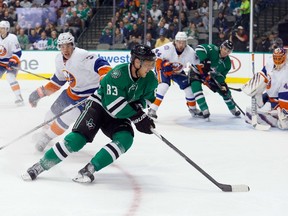 Ales Hemsky of the Dallas Stars controls the puck against Travis Hamonic of the New York Islanders during NHL play at the American Airlines Center on March 3, 2015 in Dallas. (Tom Pennington/Getty Images/AFP)