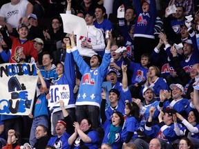 Fans of the former NHL team Quebec Nordiques cheer during a Senators and Oilers game in Ottawa on Feb. 11, 2012. Quebecor submitted a bid for an expansion franchise in Quebec City on Monday. (Patrick Doyle/Reuters/Files)