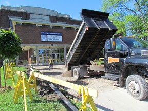 A new front entrance sidewalk being installed at Sarnia Collegiate on Tuesday July 21, 2015 in Sarnia, Ont., is part of $10 in capital work happening this year at schools in the Lambton Kent District School Board. (Paul Morden, The Observer)