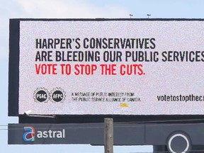 Public Service Alliance of Canada billboard along the Gardiner Expressway in Toronto on Wednesday July 22, 2015 featuring a bleeding Maple Leaf. (Michael Peake/Toronto Sun)
