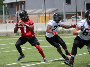 Ottawa RedBlacks quarterback Henry Burris practises at Gee-Gees Field Wednesday, July 23, 2015. (Tim Baines/Ottawa Sun)